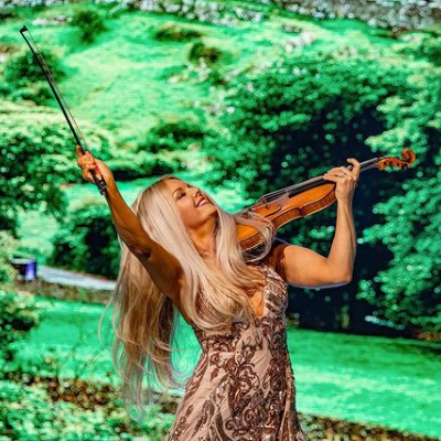 Photo of  Mairead Nesbitt while playing the violin.